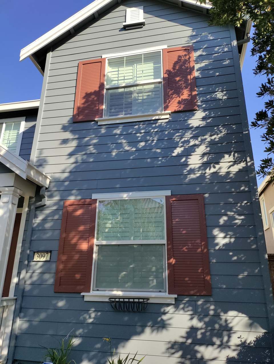 Exterior house painting with custom shutter color by Central Painting in Roseville, CA