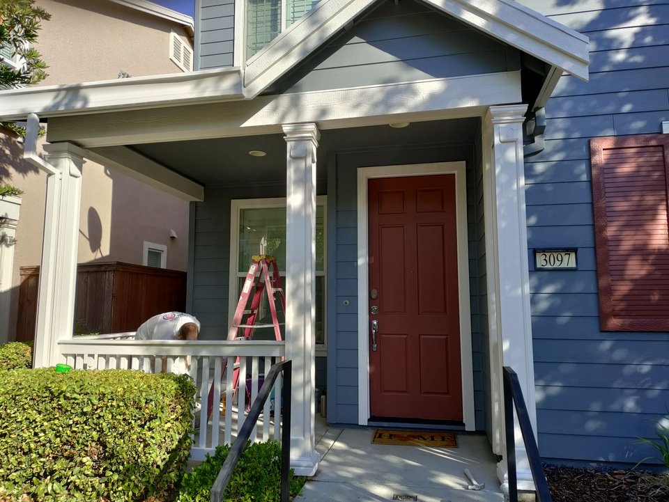 Exterior house painting with a custom red front door in Citrus Heights, CA