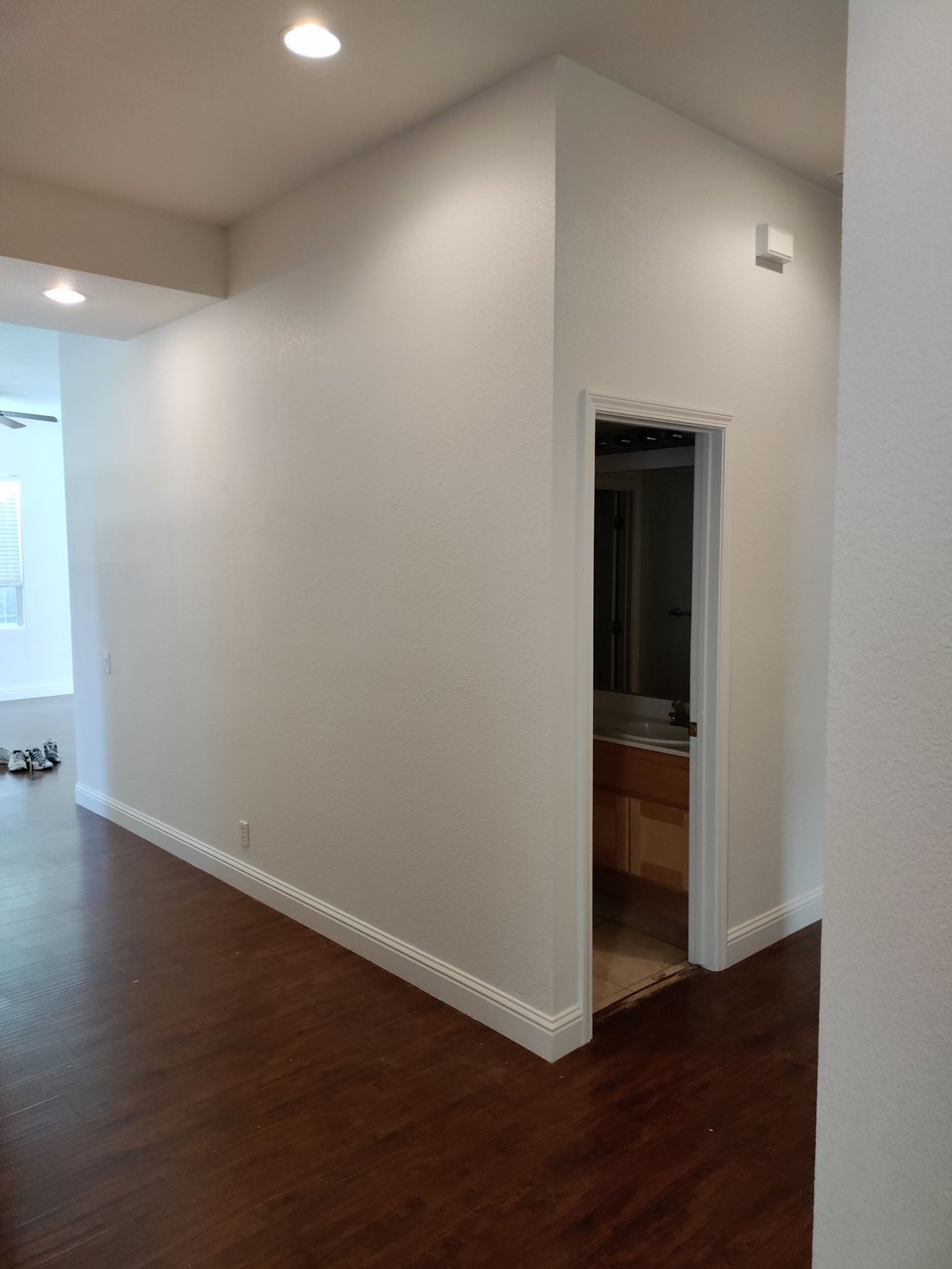 Hallway, trim and door repaint in a clean white